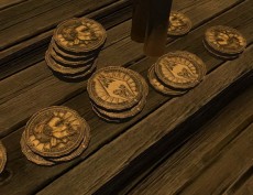Золотые монеты на деревянной поврехности