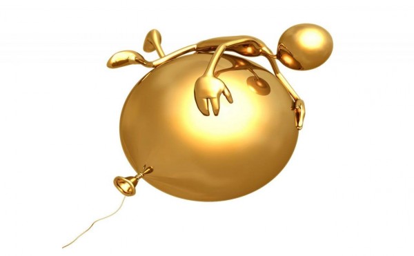 Силуэт человека сверху на шаре, выполненные в золотом цвете на белом фоне